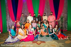 Sangeet photo of Indian couple with bridesmaids and groomsmen. Sangeet photo of Indian couple with bridesmaids and groomsmen.