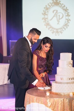 Indian wedding cutting the cake scene Indian wedding cutting the cake scene