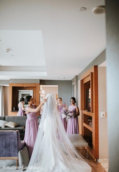 Indian bride being assisted with the wedding veil. Indian bride being assisted with the wedding veil.