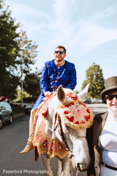 Elegant Indian groom riding baraat white horse. Elegant Indian groom riding baraat white horse.