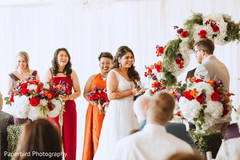 Sweet shot of bride and groom during their vows. Sweet shot of bride and groom during their vows.