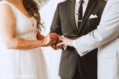 Indian bride putting ring to groom. Indian bride putting ring to groom.