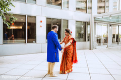 Cute indian bride and groom's first look capture. Cute indian bride and groom's first look capture.