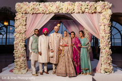 Guests and newlyweds under the mandap. Guests and newlyweds under the mandap.