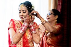 Sweet Indian mother helping her daughter. Sweet Indian mother helping her daughter.