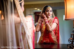 Maharani putting earring on. Maharani putting earring on.