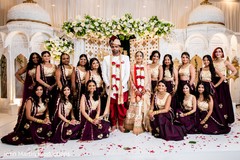 Indian couple surrounded by bridesmaids. Indian couple surrounded by bridesmaids.