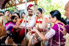 Lovely Indian couple receiving blessings from their relatives. Lovely Indian couple receiving blessings from their relatives.