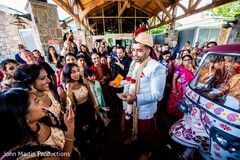 Raja being greeted by bridesmaids and guests. Raja being greeted by bridesmaids and guests.