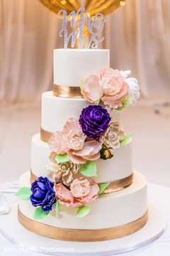 Delightful flower decorated wedding cake. Delightful flower decorated wedding cake.