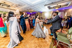 Indian couple dancing at reception party. Indian couple dancing at reception party.