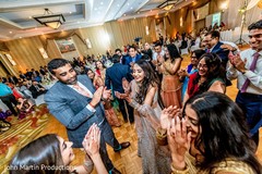 Indian couple having fun with their guests at reception party. Indian couple having fun with their guests at reception party.