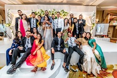 Indian couple with their loved guests at reception. Indian couple with their loved guests at reception.