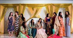 Sweet indian bride posing with bridesmaids for photo shoot Sweet indian bride posing with bridesmaids for photo shoot
