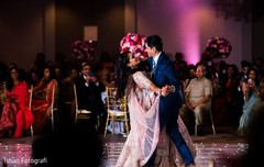 Adorable indian couple dancing during reception Adorable indian couple dancing during reception