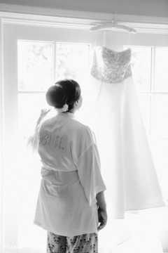 Lovely bride looking her wedding dress Lovely bride looking her wedding dress