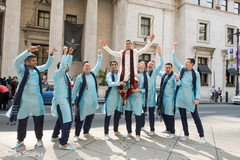 Indian groom being lifted by groomsmen. Indian groom being lifted by groomsmen.