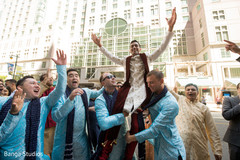 Indian groom being lifted by special guests. Indian groom being lifted by special guests.