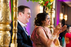 Indian bride and groom reacting to the performances. Indian bride and groom reacting to the performances.