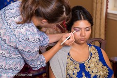 Indian bride getting her reception makeup done. Indian bride getting her reception makeup done.