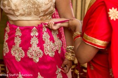 Indian bride getting her lehenga on. Indian bride getting her lehenga on.