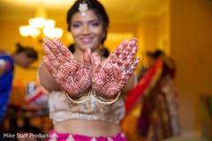 Lovely Indian bride showing her henna art. Lovely Indian bride showing her henna art.