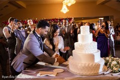 Indian wedding cake cutting fun moment. Indian wedding cake cutting fun moment.