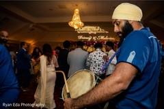 Dhol player during reception dance. Dhol player during reception dance.