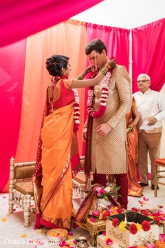 Sweet Indian bride putting garland to groom. Sweet Indian bride putting garland to groom.