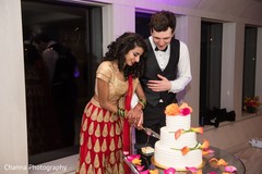 Indian wedding reception cutting the cake scene. Indian wedding reception cutting the cake scene.