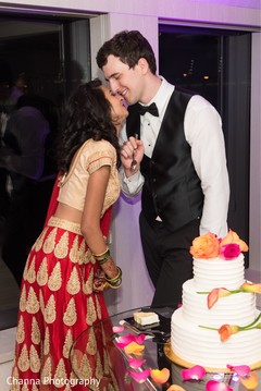 Lovely capture Indian groom giving cake to the bride. Lovely capture Indian groom giving cake to the bride.