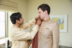 Indian groom being helped to get ready. Indian groom being helped to get ready.
