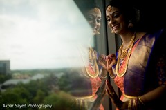 Adorable indian bride looking out the window Adorable indian bride looking out the window