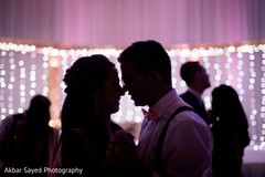Adorable indian couple dancing during reception Adorable indian couple dancing during reception