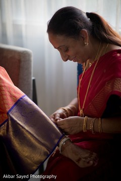 Sweet indian bride being helped to get ready Sweet indian bride being helped to get ready