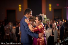 Indian groom dancing with his lovely mother Indian groom dancing with his lovely mother