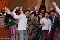 Indian groom dancing with his mother in law. Indian groom dancing with his mother in law.
