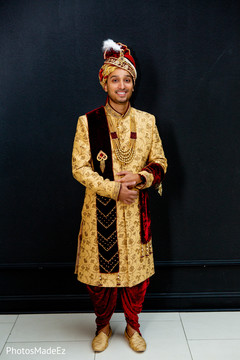 Charming indian groom getting ready scene Charming indian groom getting ready scene