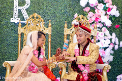 Bride and groom during the ceremony. Bride and groom during the ceremony.
