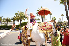 Elegant Indian groom riding baraat white horse. Elegant Indian groom riding baraat white horse.