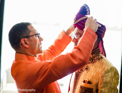 Charming indian groom getting ready scene. Charming indian groom getting ready scene.