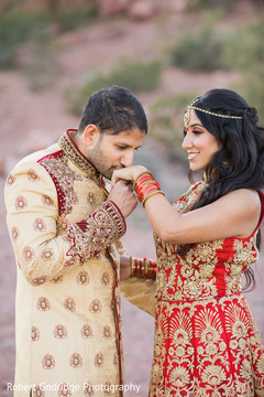 Adorable groom kissing bride's hand Adorable groom kissing bride's hand