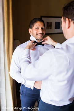 Enhancing groom getting ready for wedding ceremony Enhancing groom getting ready for wedding ceremony