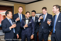 Elegant indian groom celebrating with his groomsman Elegant indian groom celebrating with his groomsman