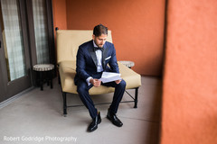 Indian groom reading bride's card Indian groom reading bride's card