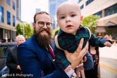 Guest with baby during the baraat. Guest with baby during the baraat.