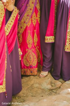 Closeup capture of Indian brides lehenga and bridesmaids shoe. Closeup capture of Indian brides lehenga and bridesmaids shoe.