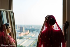 Charming indian bride looking out the window Charming indian bride looking out the window