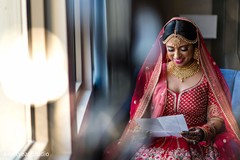Sweet indian bride reading groom's card Sweet indian bride reading groom's card