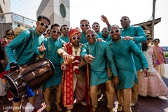 Indian groom with groomsmen during baraat Indian groom with groomsmen during baraat